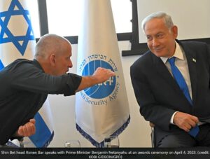 Shin Bet head Ronen Bar speaks with Prime Minister Benjamin Netanyahu at an awards ceremony on April 4, 2023. (credit: KOBI GIDEON/GPO)